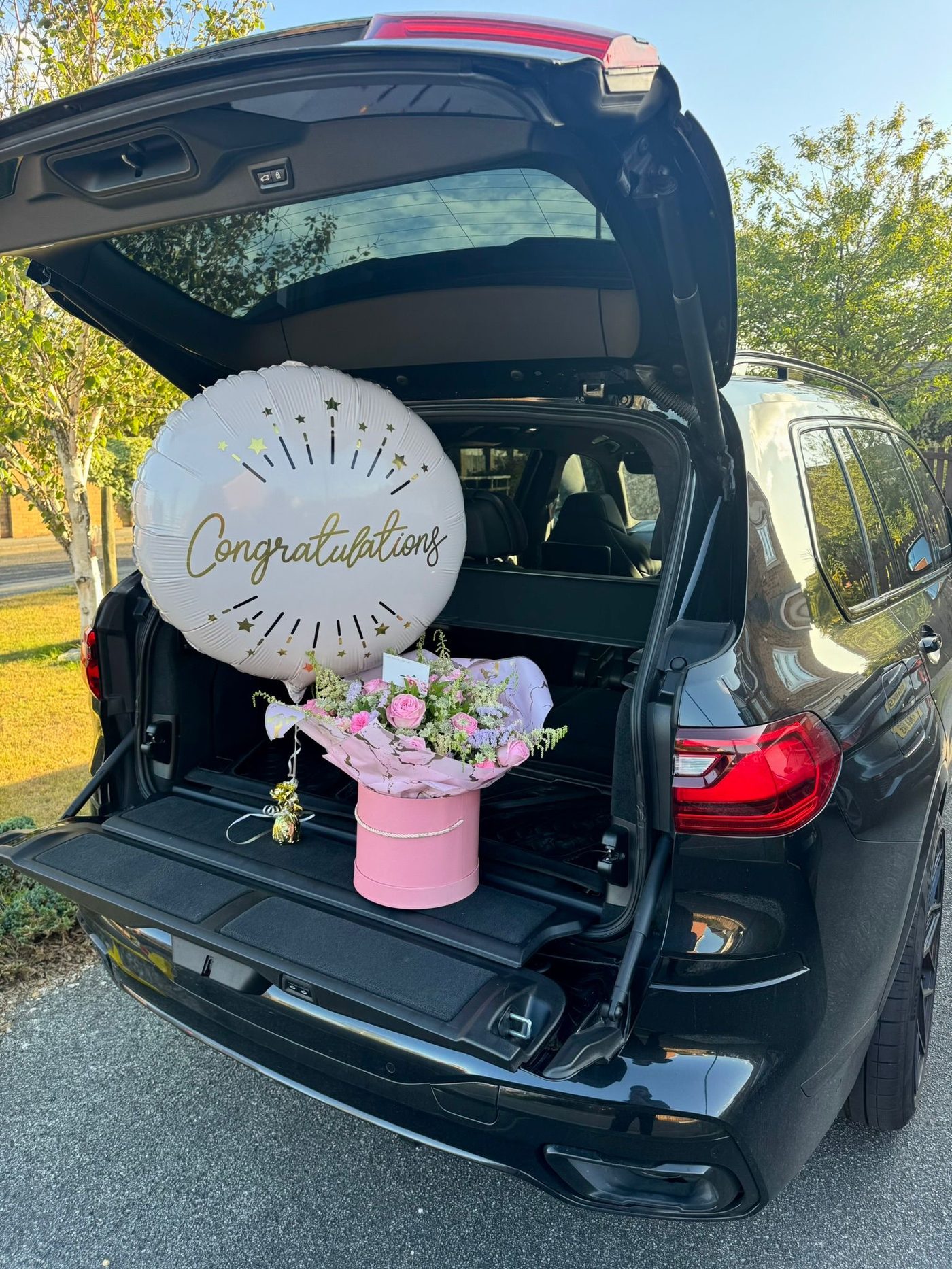 Pink hatbox bouquet with Congratulations balloon