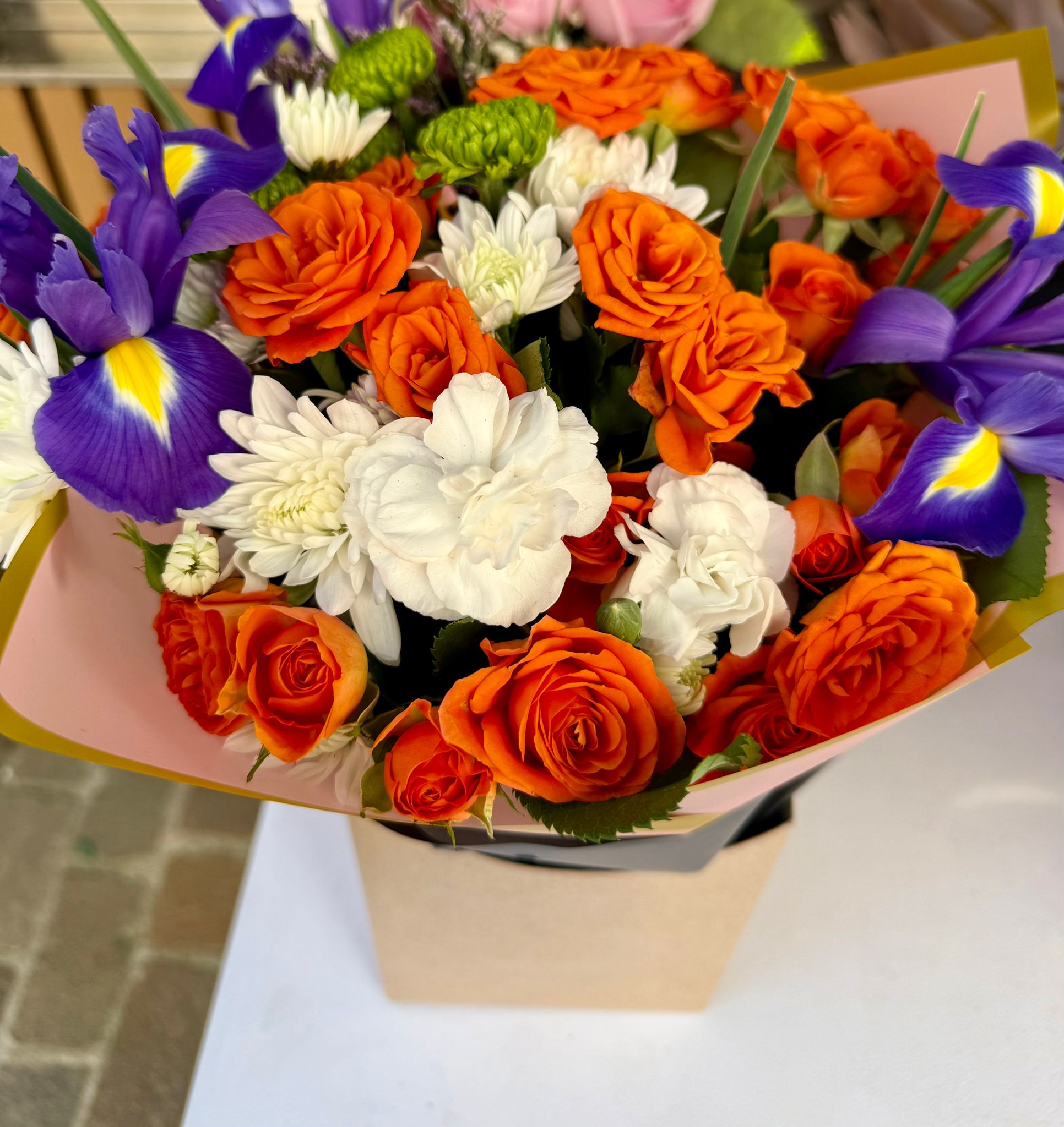 Orange roses with purple iris