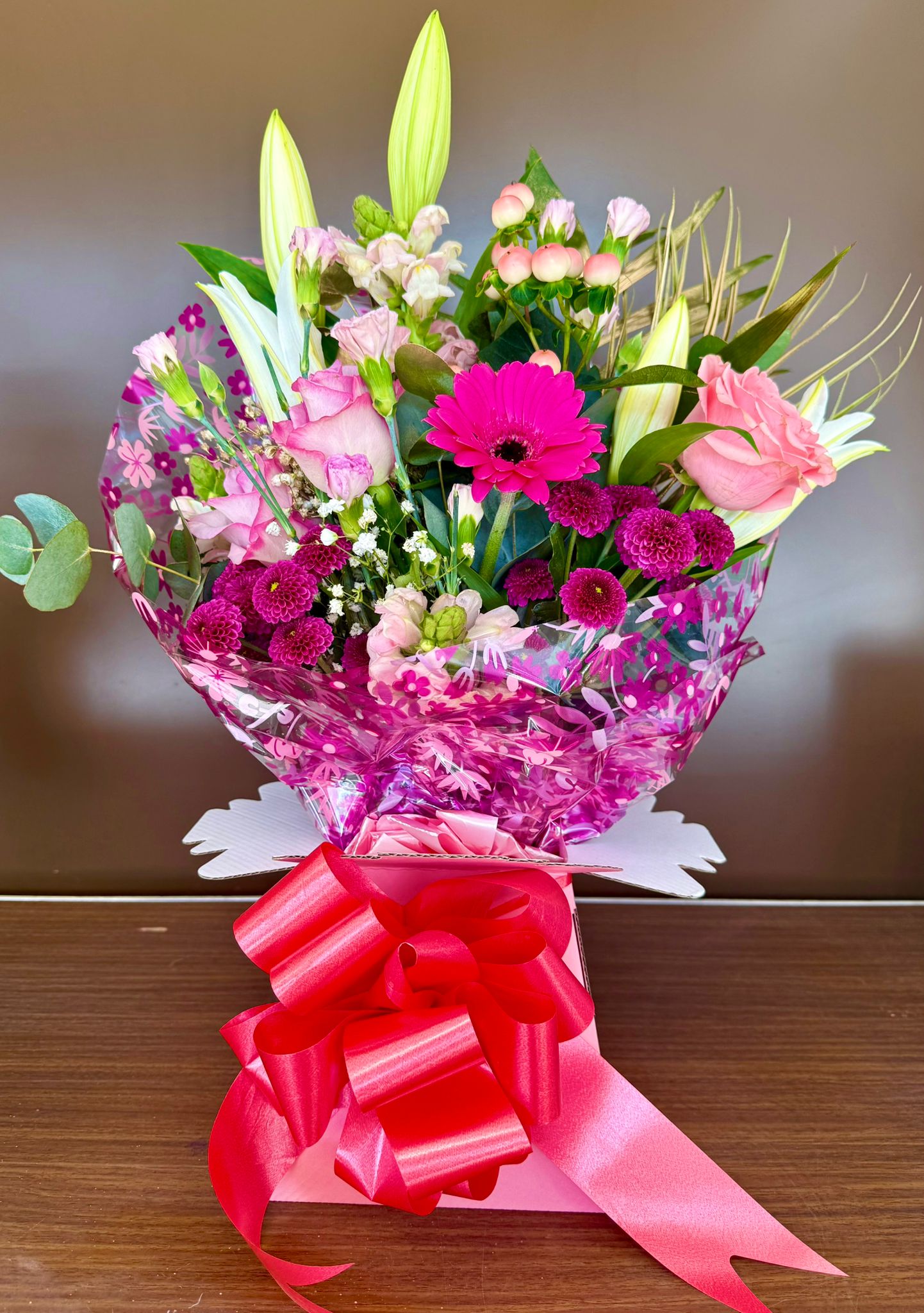 Pink bouquet with red bow