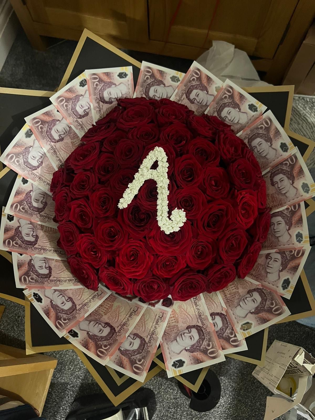 Red roses with money fan and personalised A initial