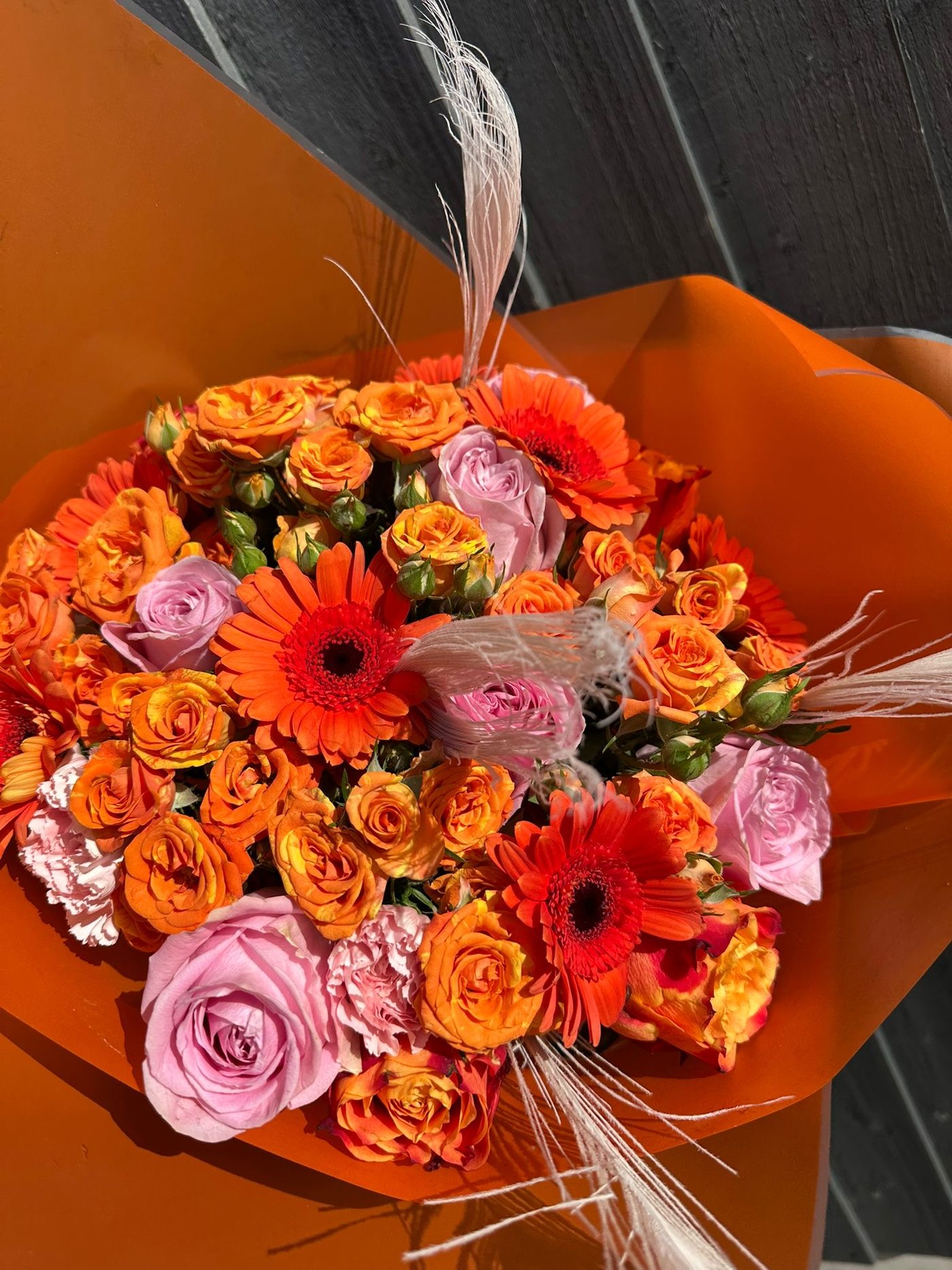 Vibrant orange and pink celebration bouquet