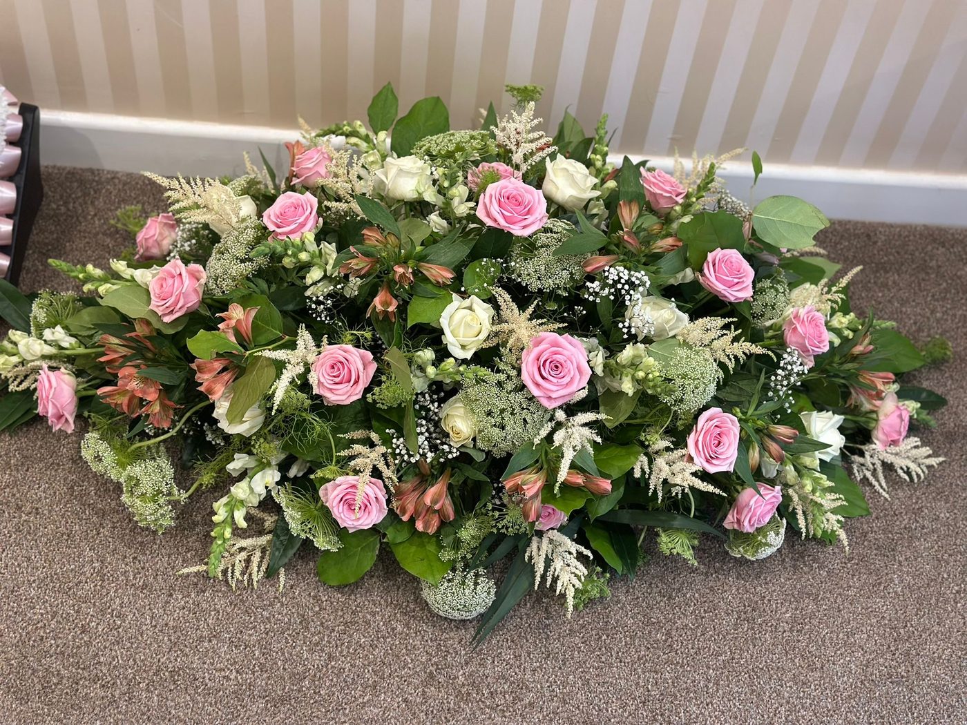 Pink and white casket spray