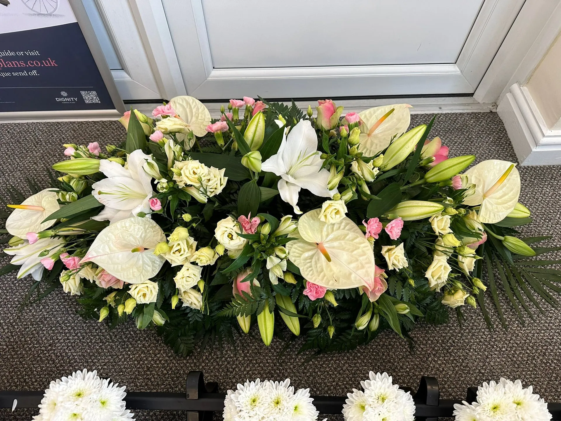 White casket spray