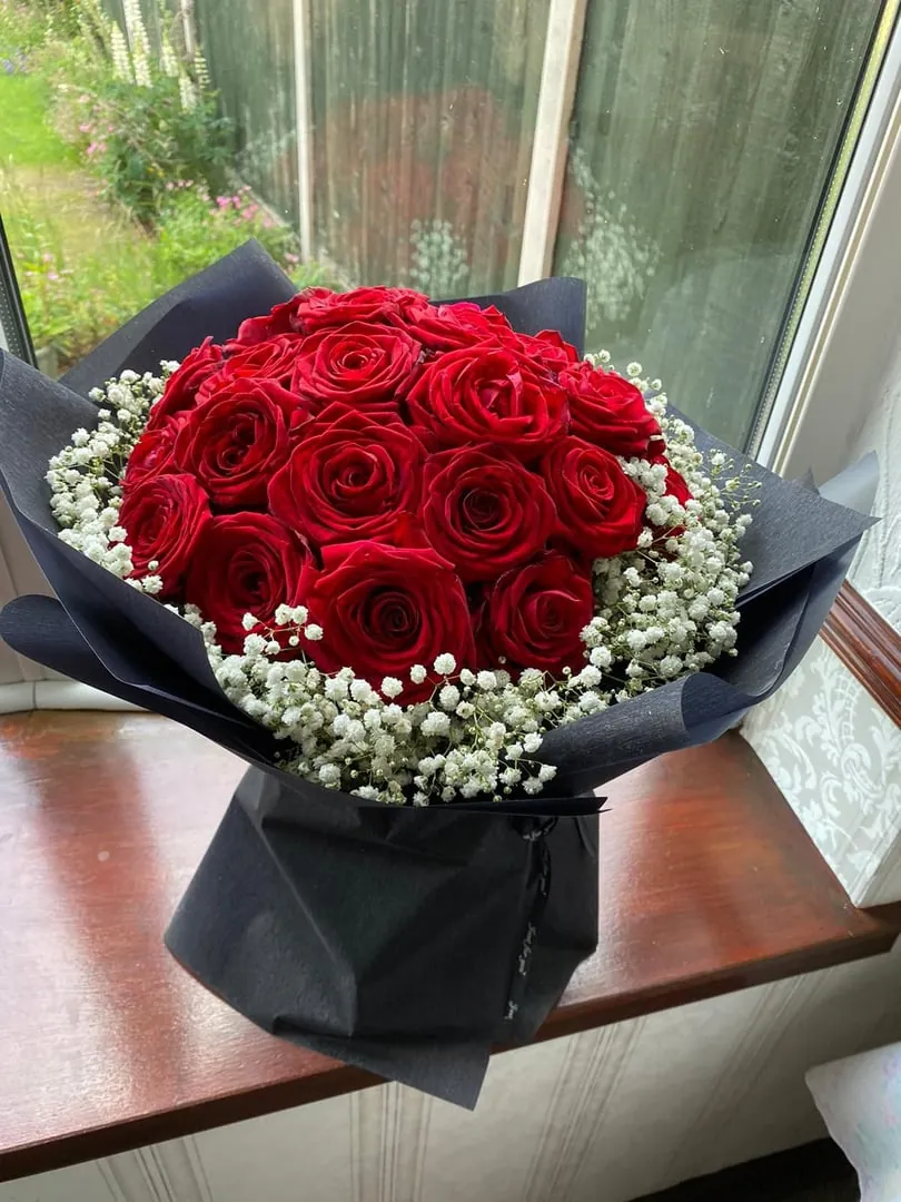 Red roses with black wrap