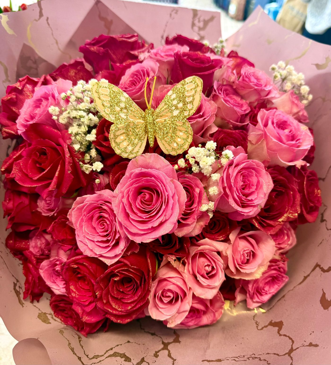Pink magenta roses with butterfly