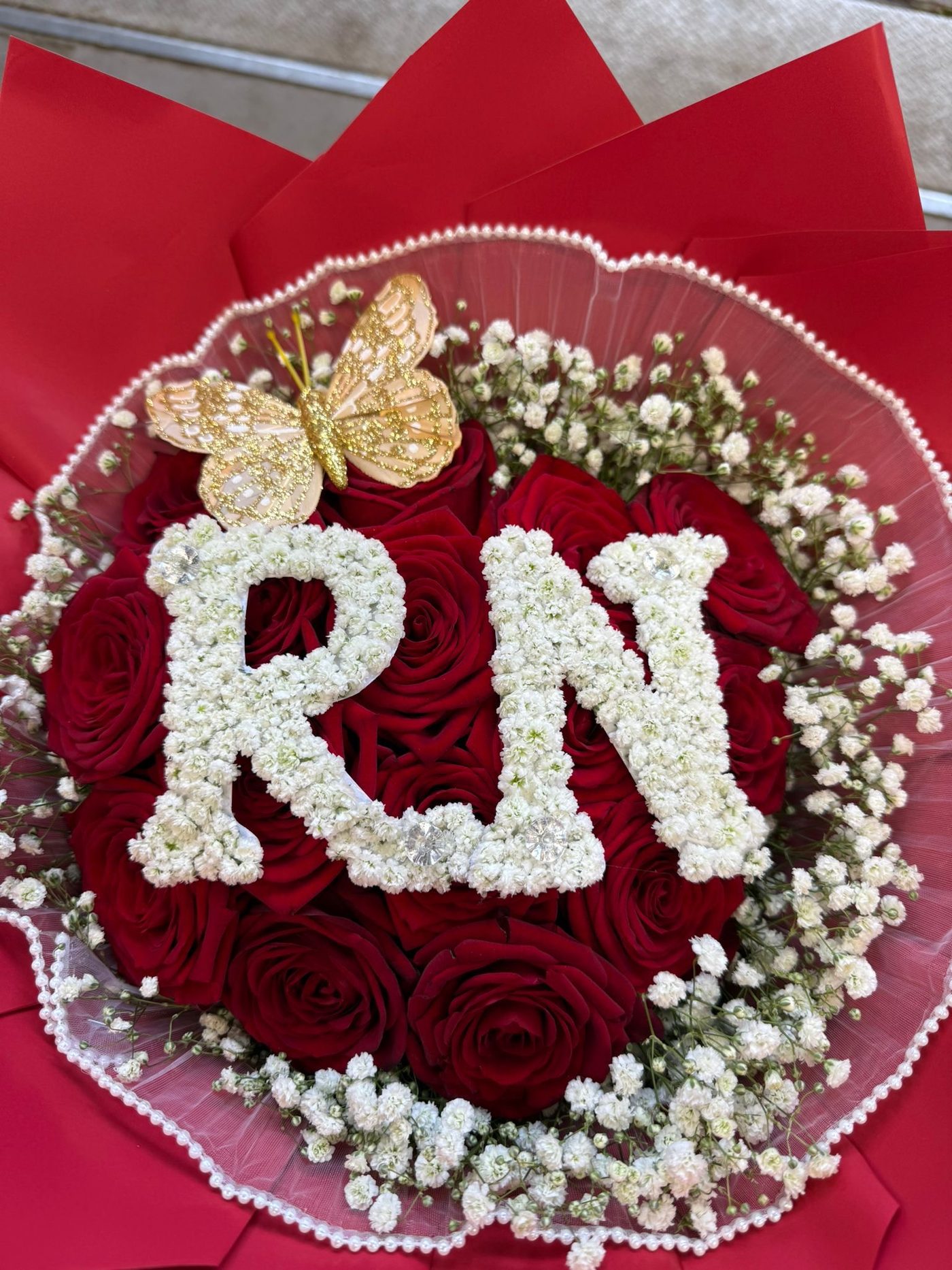 Red roses with personalised RN initials