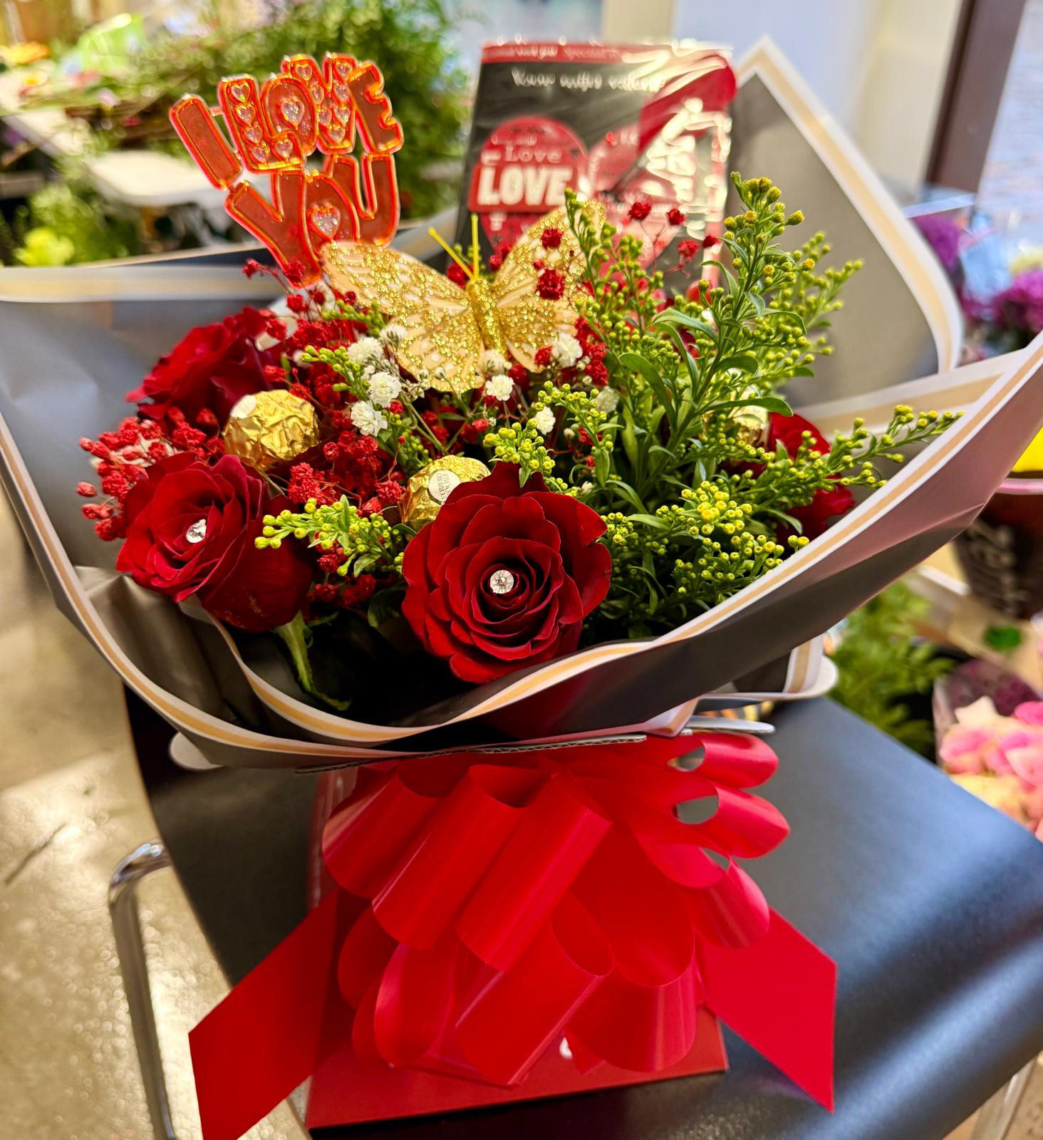 Red roses with I love you message