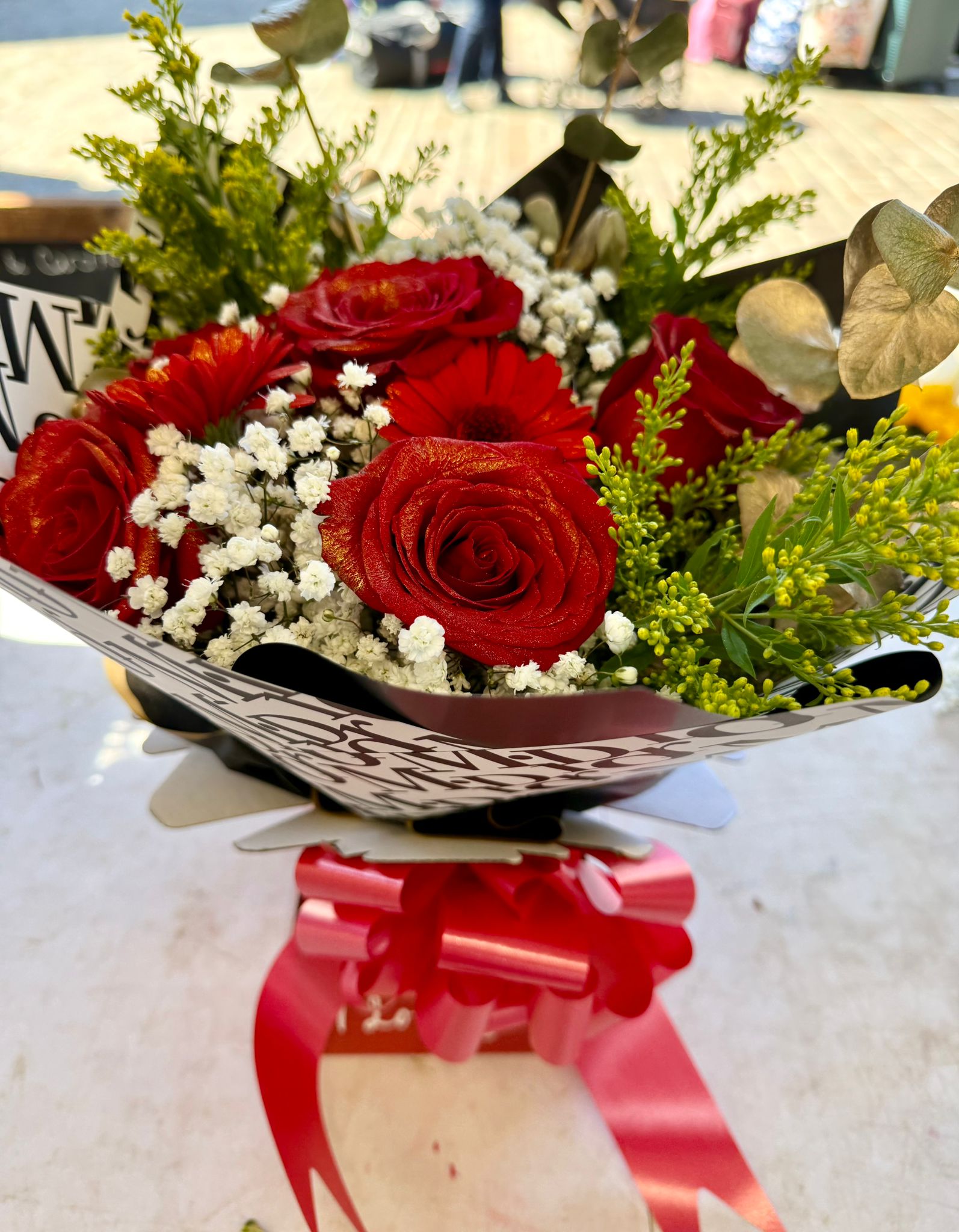 Red roses in monochrome wrap
