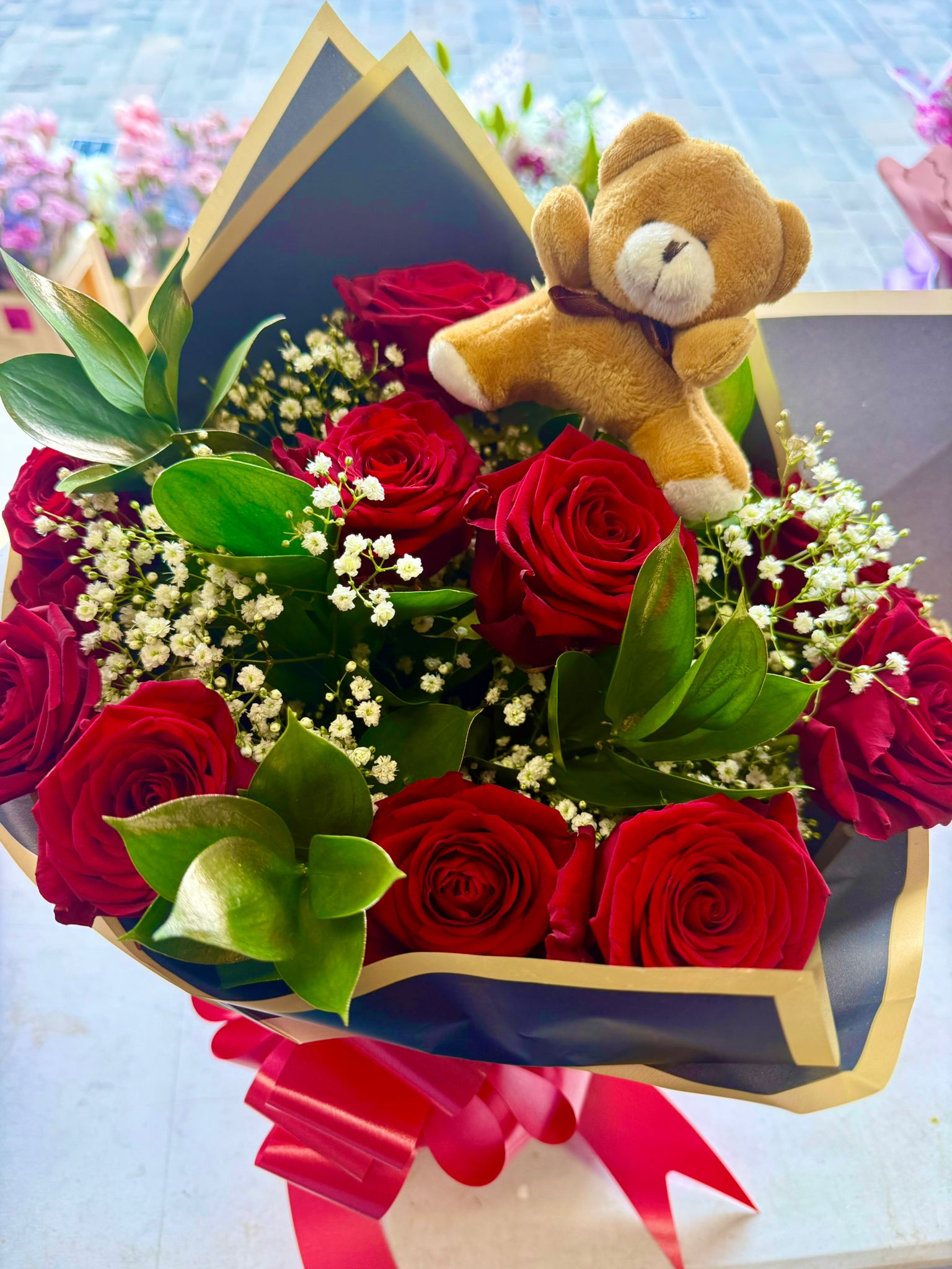 Red roses with teddy bear