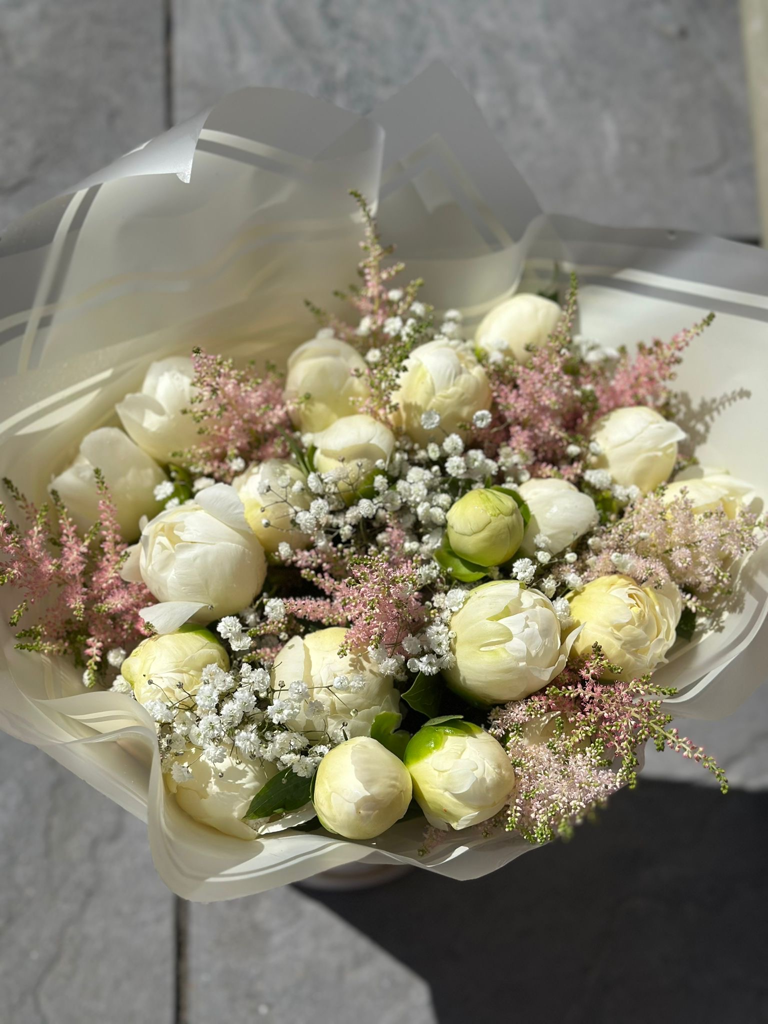 Soft white peony bouquet with pink astilbe